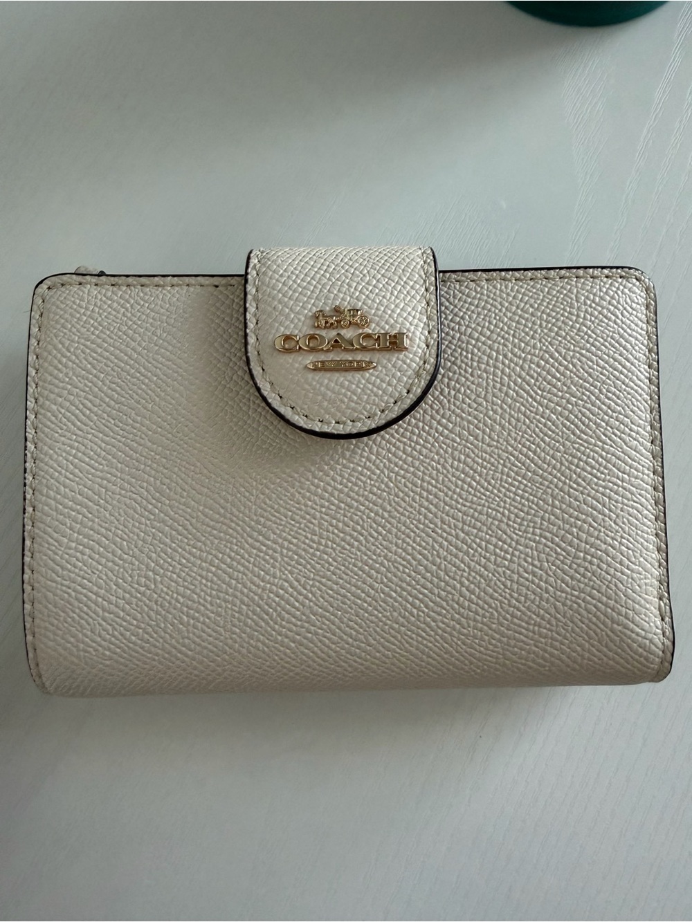 Coach Pebbled Leather Compact Wallet in Light Cream with Gold Logo